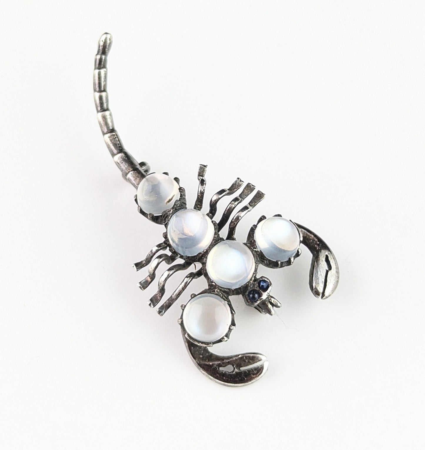 Antique Sterling silver and Moonstone scorpion brooch, blue paste eyes