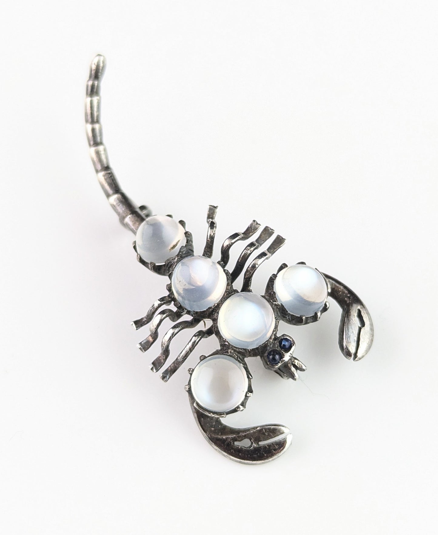 Antique Sterling silver and Moonstone scorpion brooch, blue paste eyes