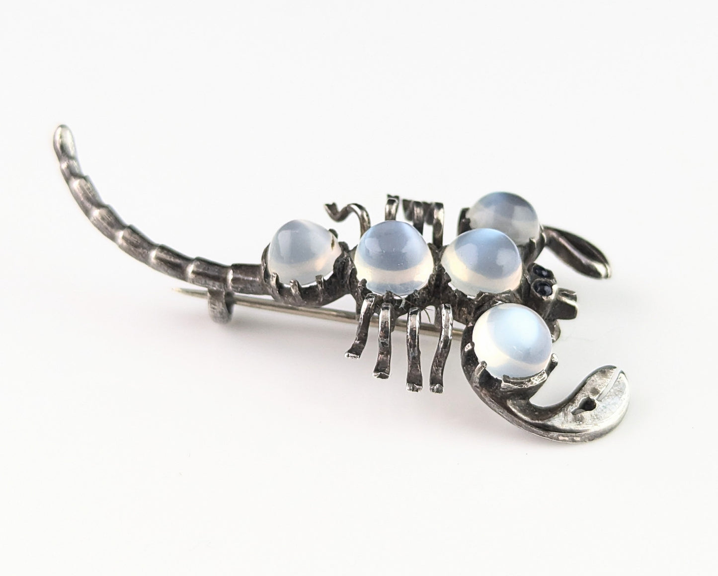 Antique Sterling silver and Moonstone scorpion brooch, blue paste eyes