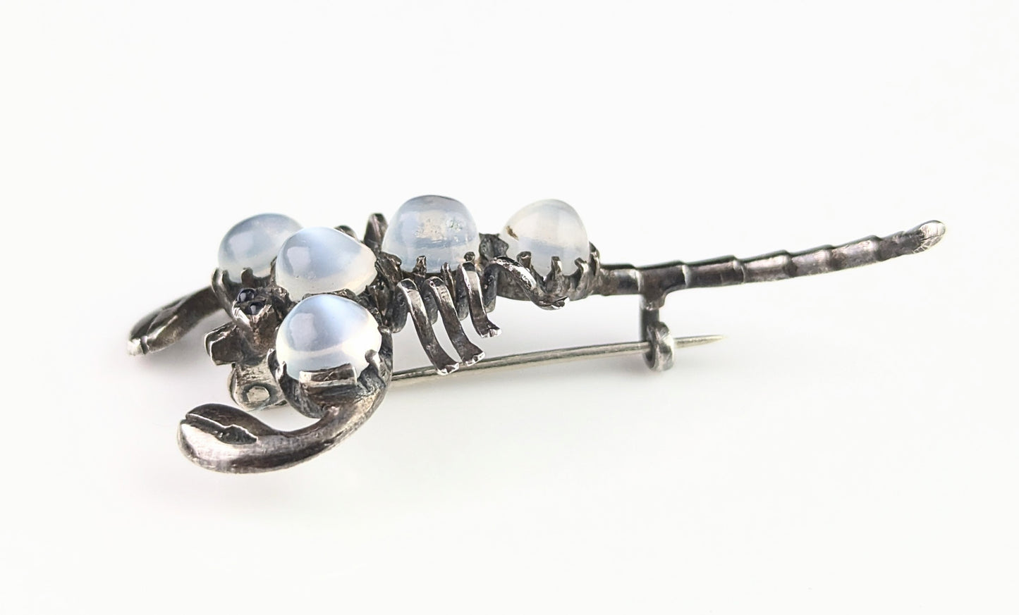 Antique Sterling silver and Moonstone scorpion brooch, blue paste eyes