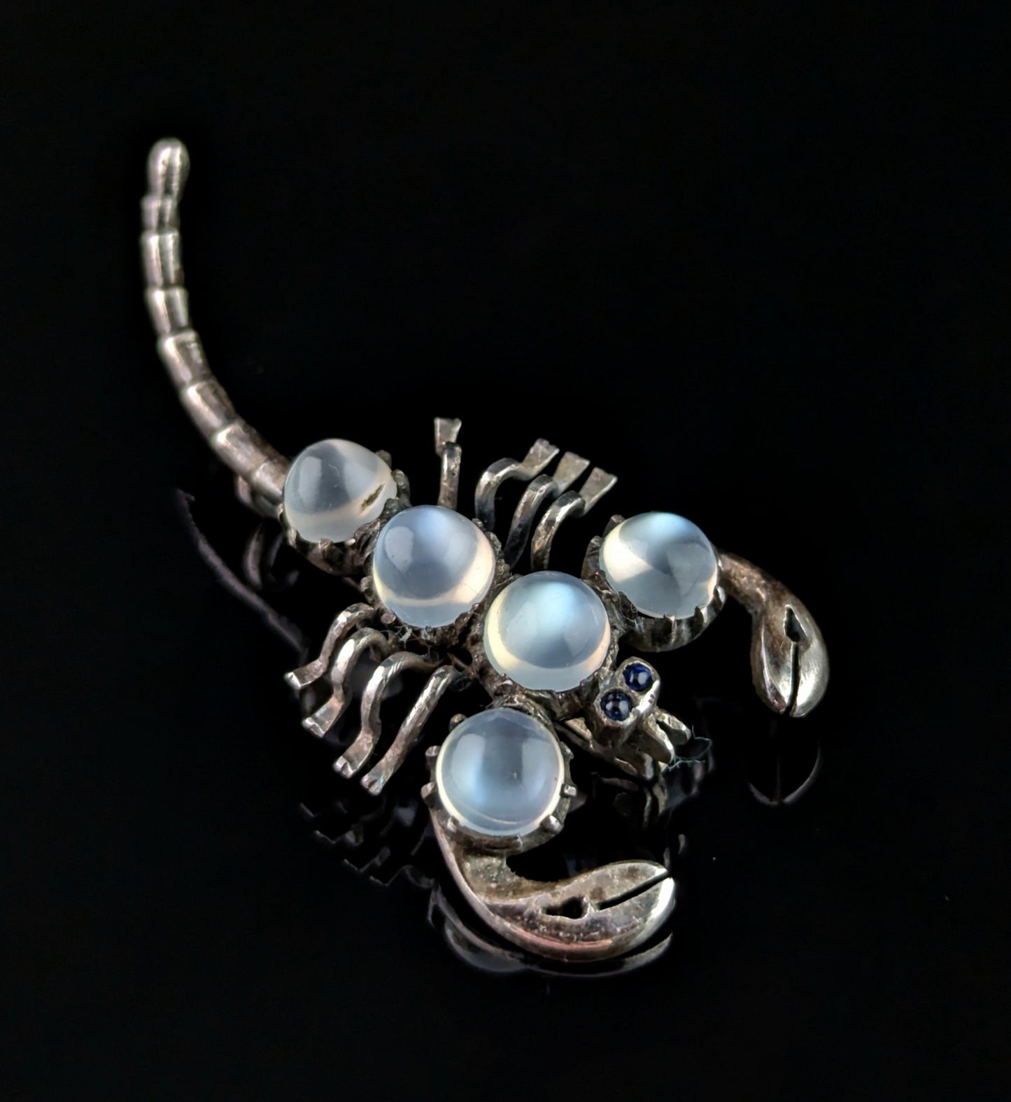 Antique Sterling silver and Moonstone scorpion brooch, blue paste eyes