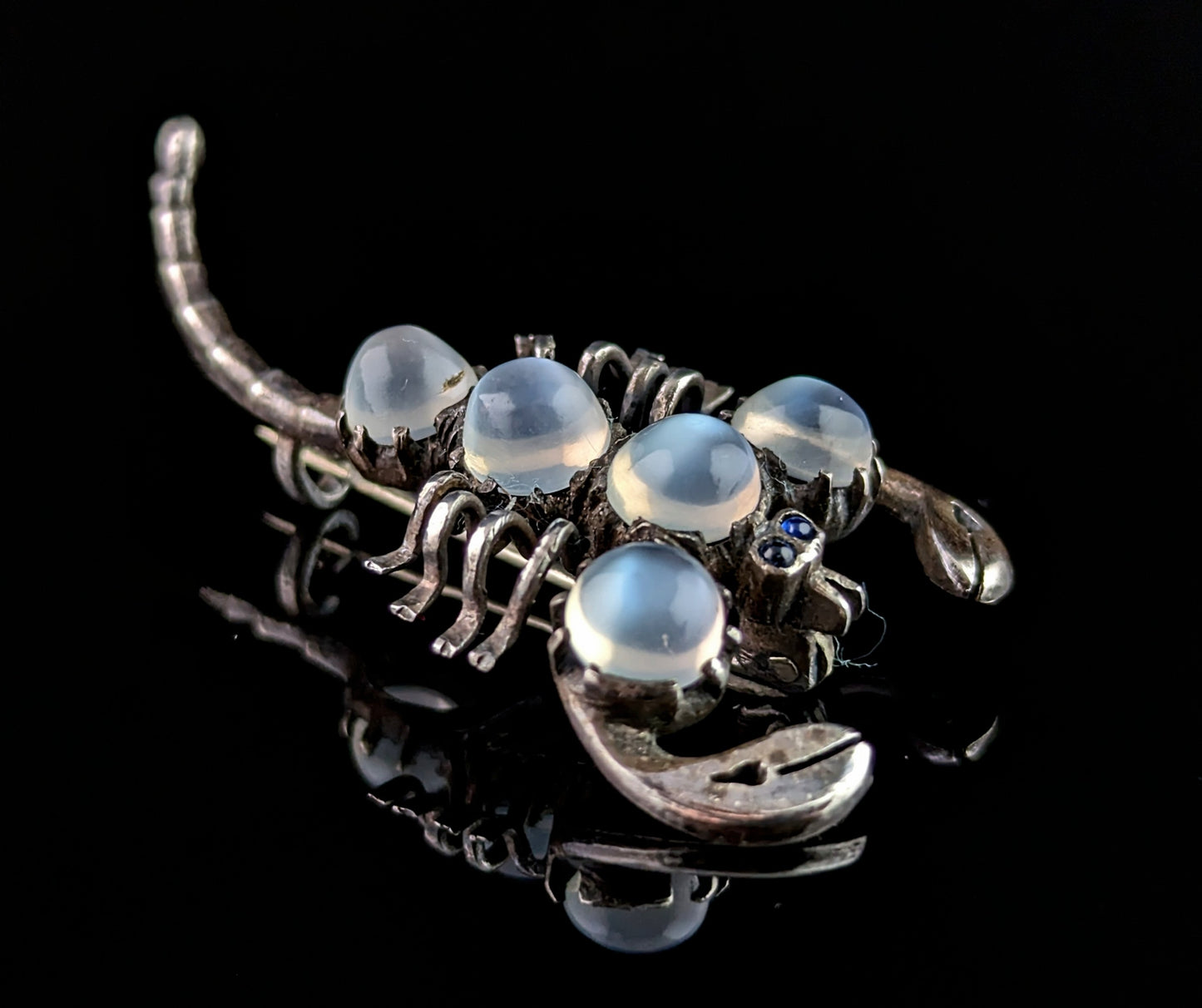 Antique Sterling silver and Moonstone scorpion brooch, blue paste eyes