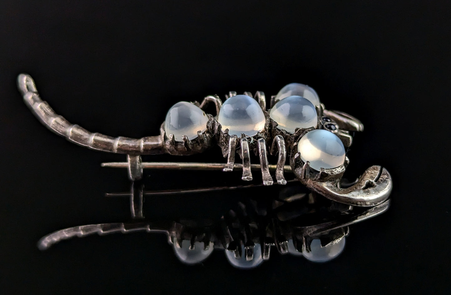 Antique Sterling silver and Moonstone scorpion brooch, blue paste eyes