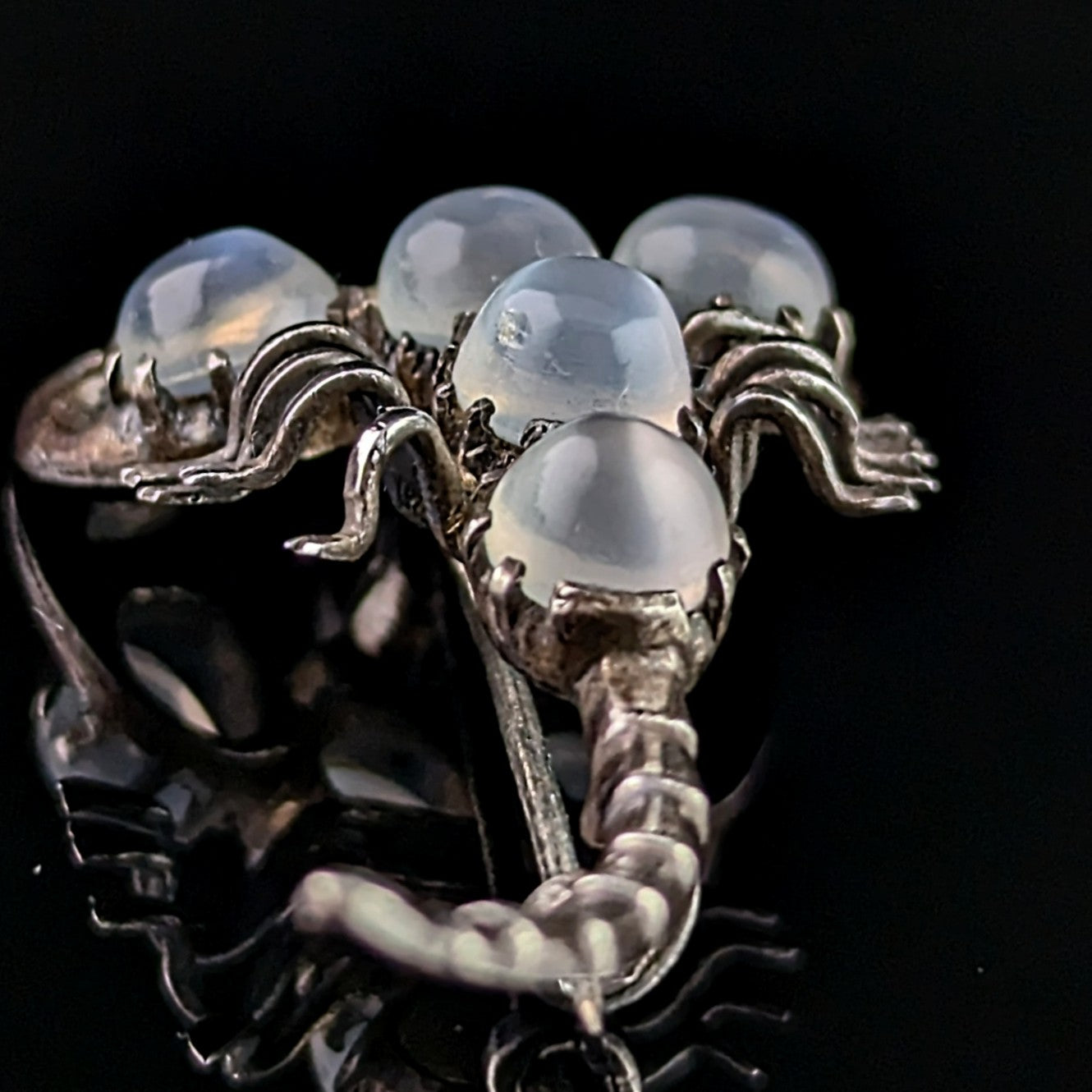 Antique Sterling silver and Moonstone scorpion brooch, blue paste eyes