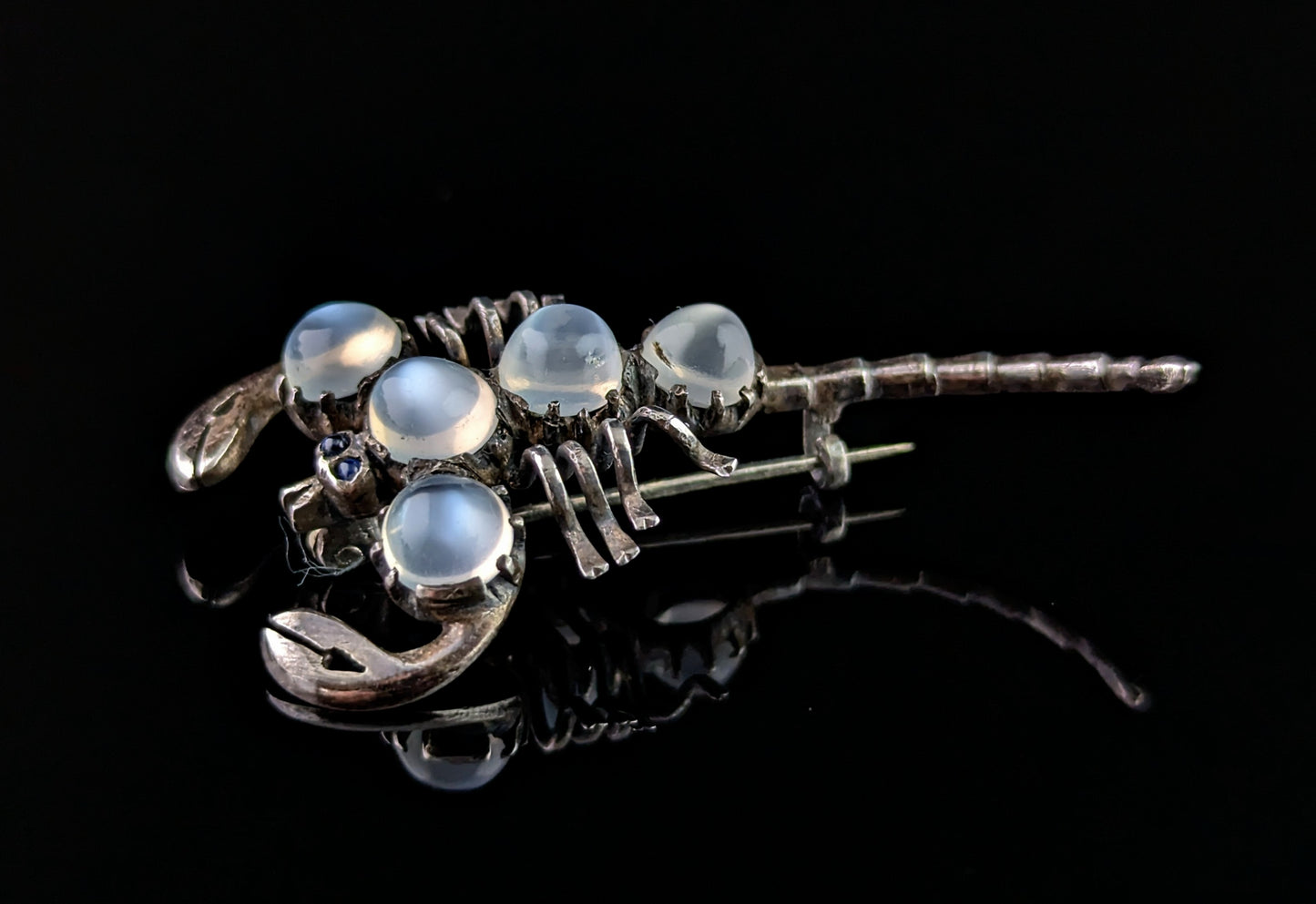 Antique Sterling silver and Moonstone scorpion brooch, blue paste eyes