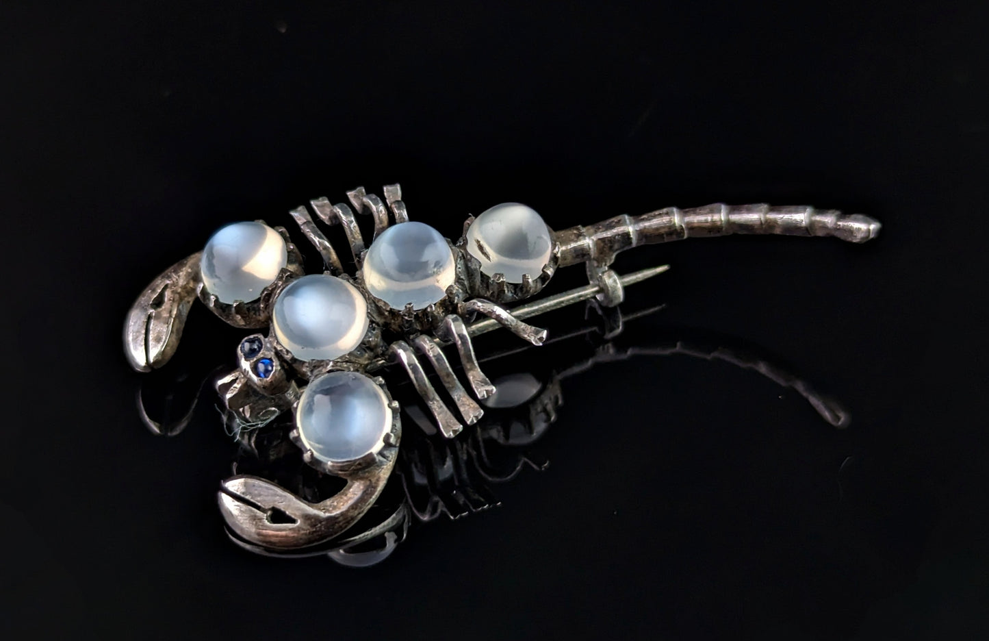 Antique Sterling silver and Moonstone scorpion brooch, blue paste eyes