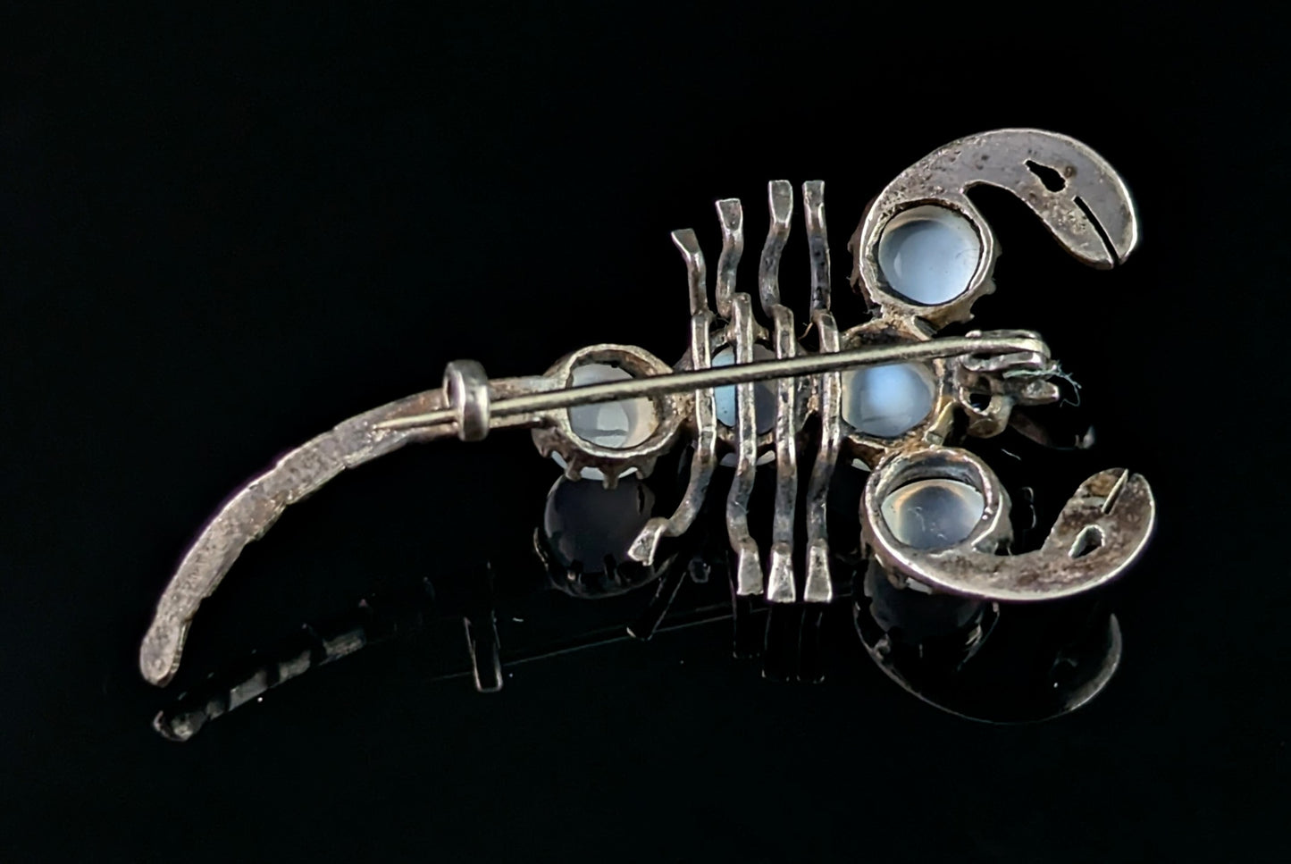 Antique Sterling silver and Moonstone scorpion brooch, blue paste eyes